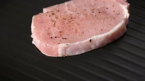 Seasoned Raw Pork Loin on Grill Indoors