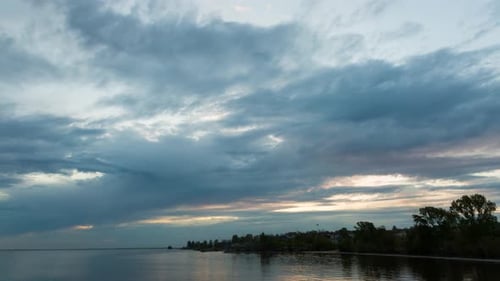Clouds During Sunset Near The River Bank, Timelapse