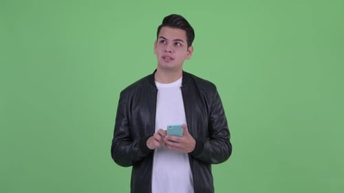 Young Adult with Mobile Phone Thinking, Smiling