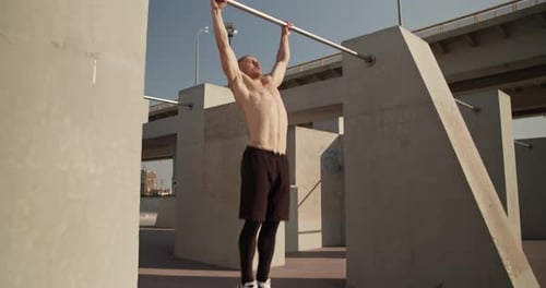 Sportsman Doing Pull Ups on Bar