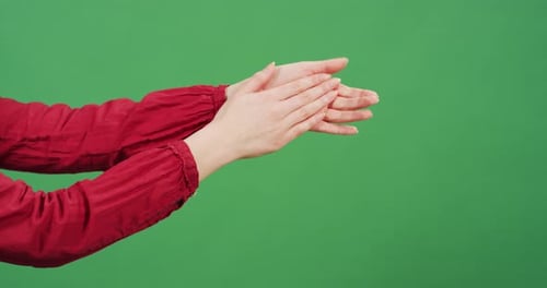 Side view of hands applauding