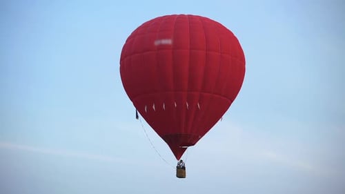 Amazing View of Beautiful Red Hot Air Balloon Flying in the Sky, Freedom