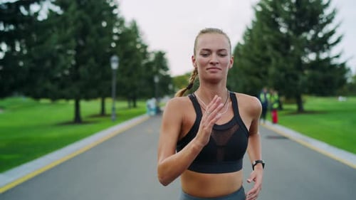 Happy Athletic Woman Jogging in Park, Girl Doing Cardio Workout Outdoors