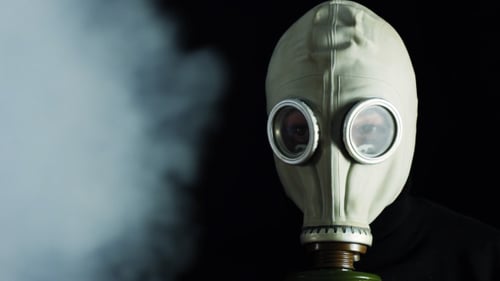 Gas Mask Obscured by Ominous White Smoke
