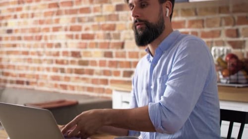 Man Working Remotely in Home Office