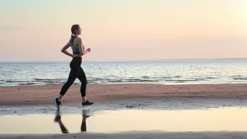 Sports Woman Running Outdoor Training at Sunset Beach Sea Landscape Enjoy Healthy Lifestyle Slowmo