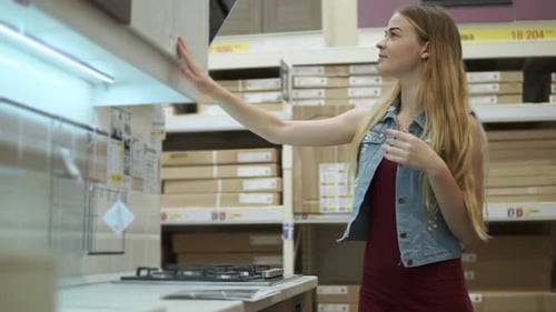 Woman Looking for New Kitchen Set