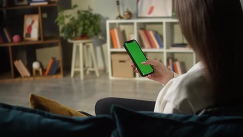 Woman Using Smartphone with Green Screen