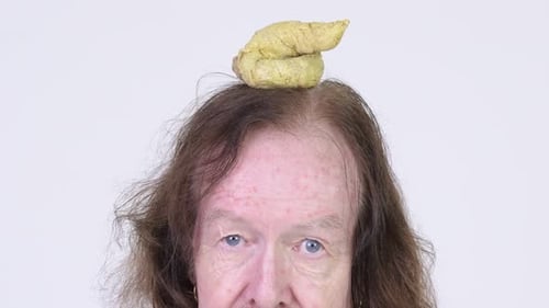 Happy Senior Man with Mustache Having Poo on Head