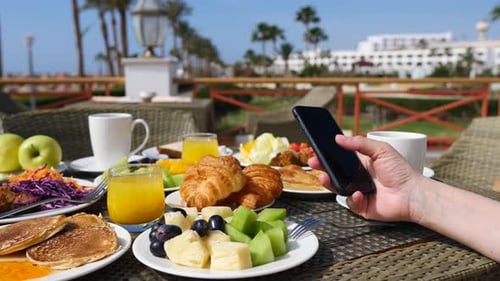 Breakfast at Resort, Person Using Smartphone