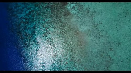 Aerial above texture of exotic resort beach adventure by blue ocean with white sandy background of a