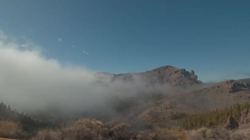 A Beautiful Mountain Landscape Through the Window of a Moving Car