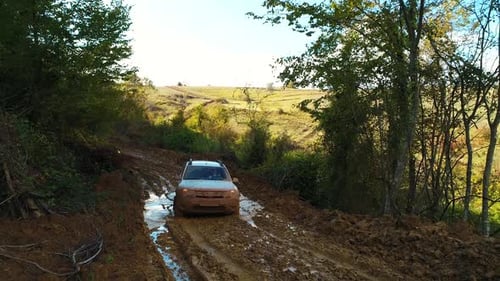 Car on Rough Muddy Road