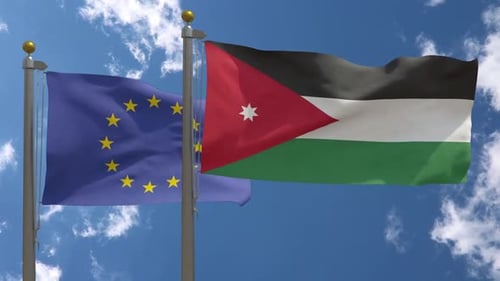 European Union and Jordan Flags Waving Together in Blue Sky