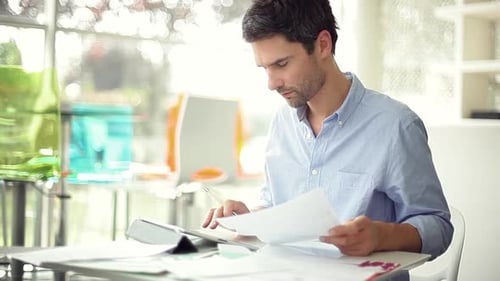 Man using digital tablet in office
