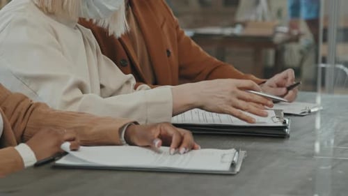 Team Reviewing Documents in Corporate Meeting Room