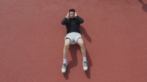 Young man doing abs exercise