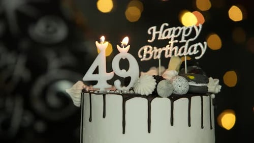 Birthday Cake with Candles and 'Happy Birthday' Topper