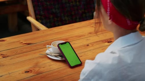 Happy Girl Talking on Video Call Via Phone or Watching Video in Street Cafe Easy Lifestyle and