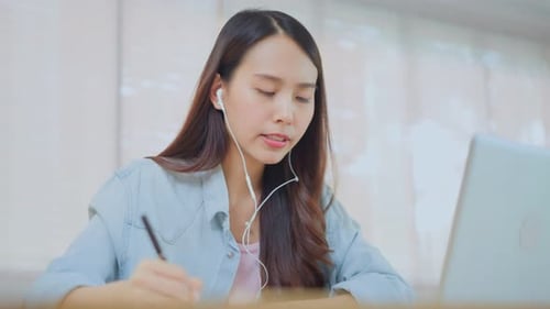 Distance learning of Asian Beautiful school girl study virtual onlin, watching internet video course