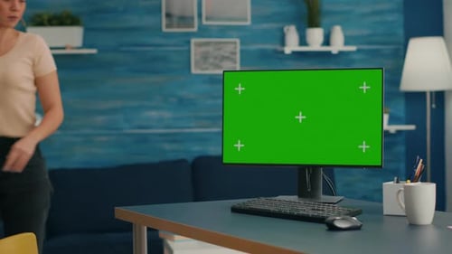 Woman Uses Green Screen Computer at Home