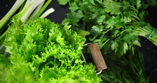Fresh Green Vegetables on Black Background