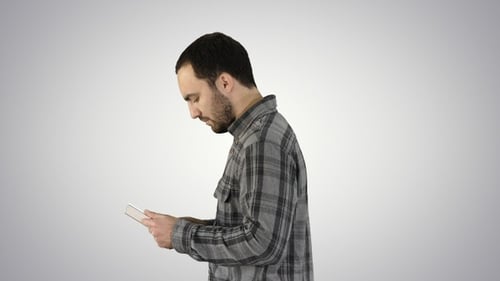 Tablet computer Side view of man using digital tablet on