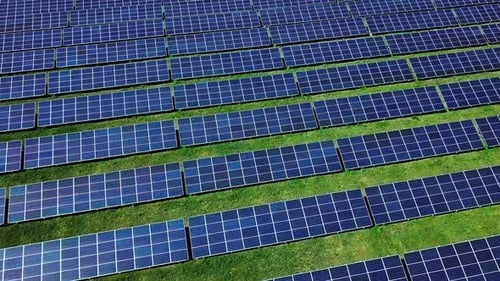 Large Field Of Blue Photovoltaic Solar Panels. Aerial View