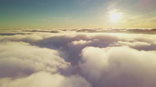 Aerial View Above the Clouds at Sunrise