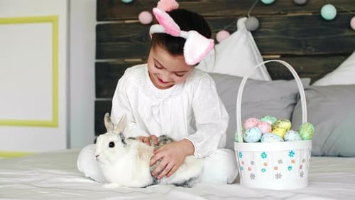Girl With Bunny Ears Petted Her Pet Rabbit