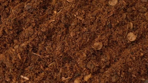 Textured Mound of Brown Fragmented Powder Close Up
