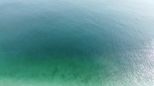 Aerial View From Above on Azure Sea and Pink Pebbles Beach