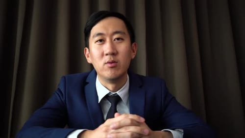 Man in Suit Communicating Online