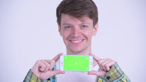Young Adult Holding Phone with Green Screen
