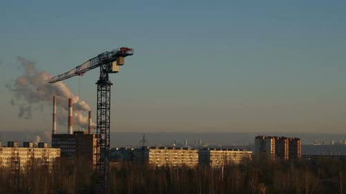 Timelapse Footage of Crane at Smoking Pipes Background