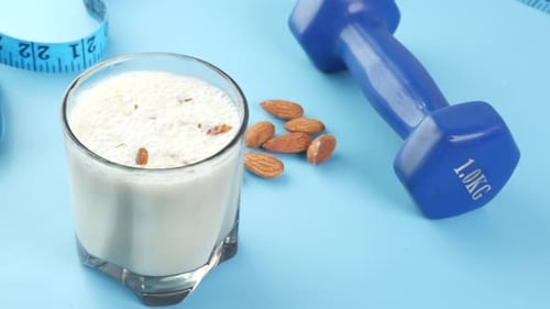 Healthy Smoothie with Dumbbell and Measuring Tape