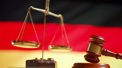 Scales of Justice with Gavel and German Flag
