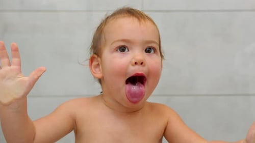 Happy Toddler Smiling in the Bathroom