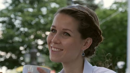 Businesswoman Smiling in Cafe