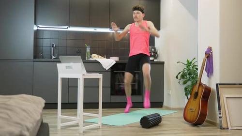 Enthusiastic Young Adult Exercising at Home