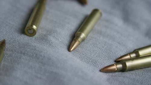 Bullets Pile Up on Gray Surface