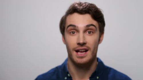 Man Showing Smartphone with Green Screen. Male Showing Phone with Chroma Key