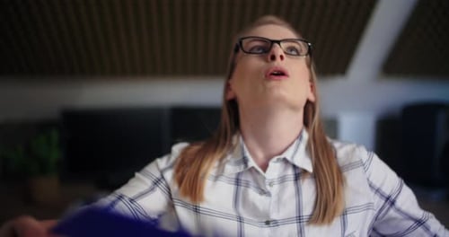 Professional Using Clipboard To Cool In Office