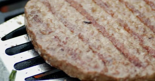 A Juicy Burger Made of Fresh Meat on the Grill.