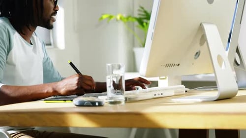 Graphic designer using graphics tablet