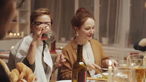 Adults Enjoy Dinner and Wine with Friends