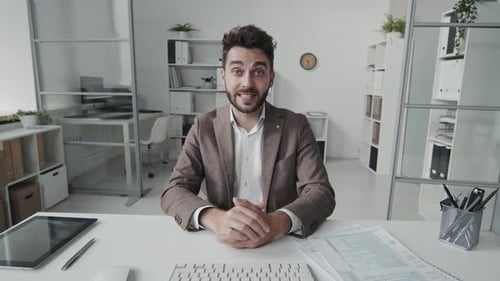 Professional Man Communicating from Modern Office Environment