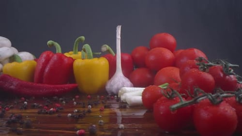 Fresh vegetables on a wooden surface with water droplets
