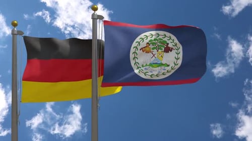 Germany and Belize Flags Waving in Wind Against Blue Sky