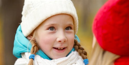 Child Talking Outside in Autumn Weather